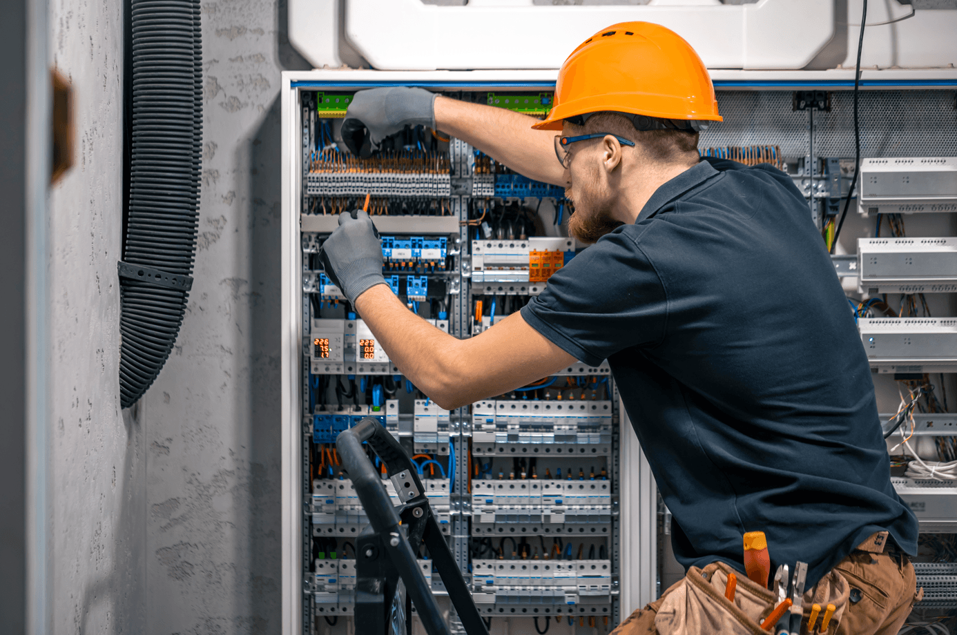 Electrician performing detailed repair work